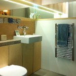 mirror feature / concrete counter / concealed LED lighting / plywood storage