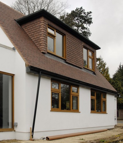 remodeled to recreate original with increased dormer and window sizes