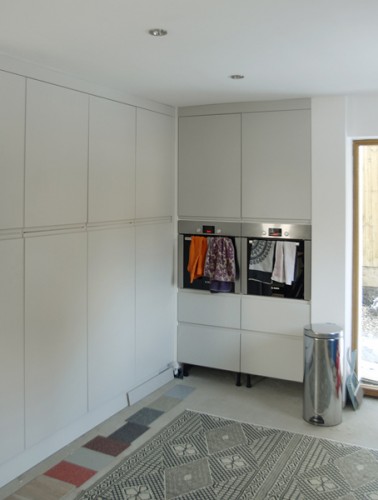 floor to ceiling kitchen storage / glass door to increase lightgain and aid passive security
