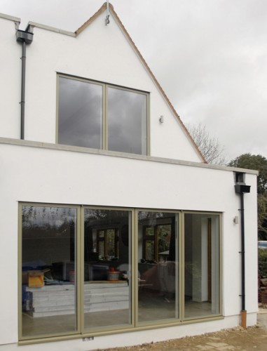 large sliding doors to maximise lightgain with unobstructed views through living room to dining area